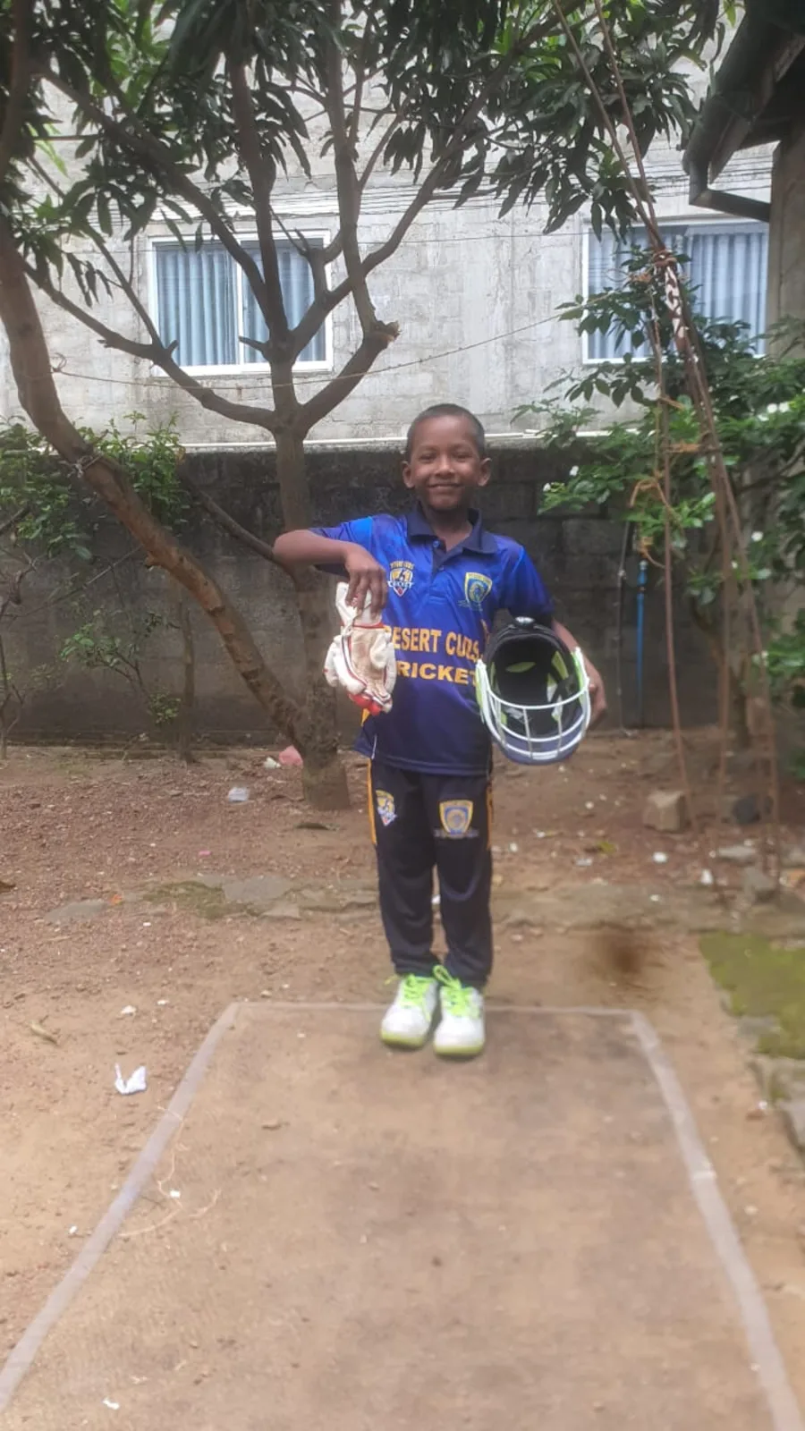 Young Sri Lankan cricketer with Desert Cubs cricket gear kit bat pads helmet 2025 charity