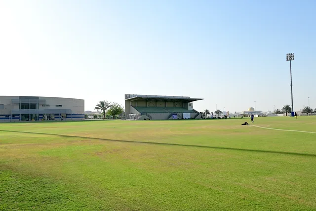 Wide view of the natural grass cricket ground and centre pitches at SES